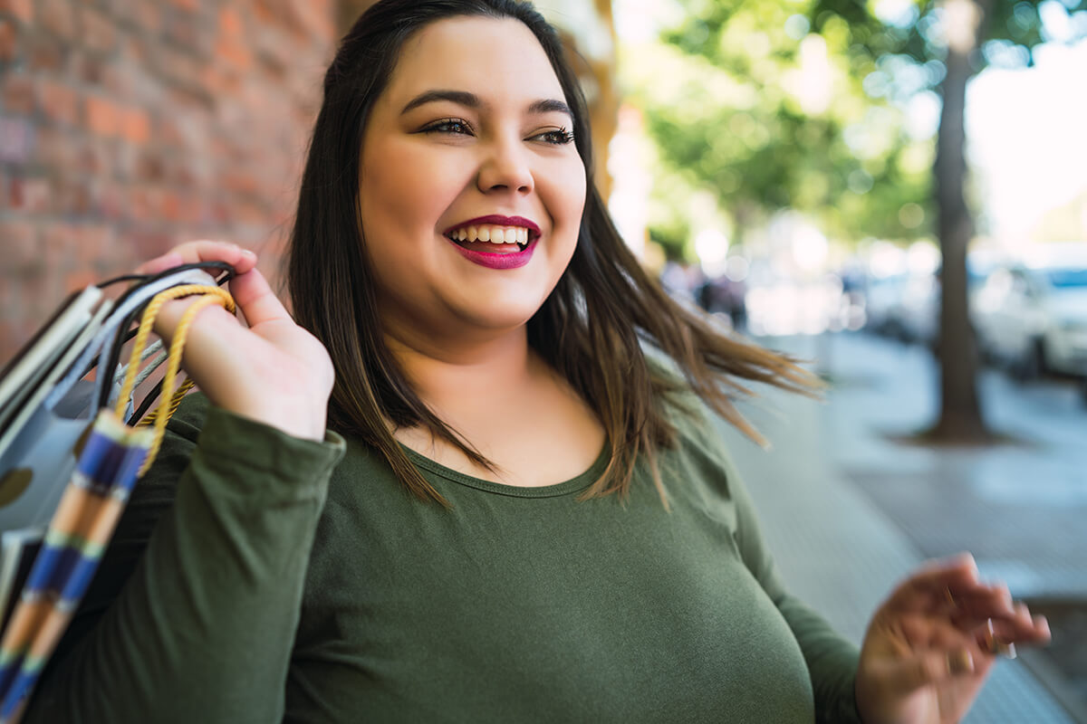 young-woman-holding-shopping-bags-2024-10-16-07-44-14-utc (1)