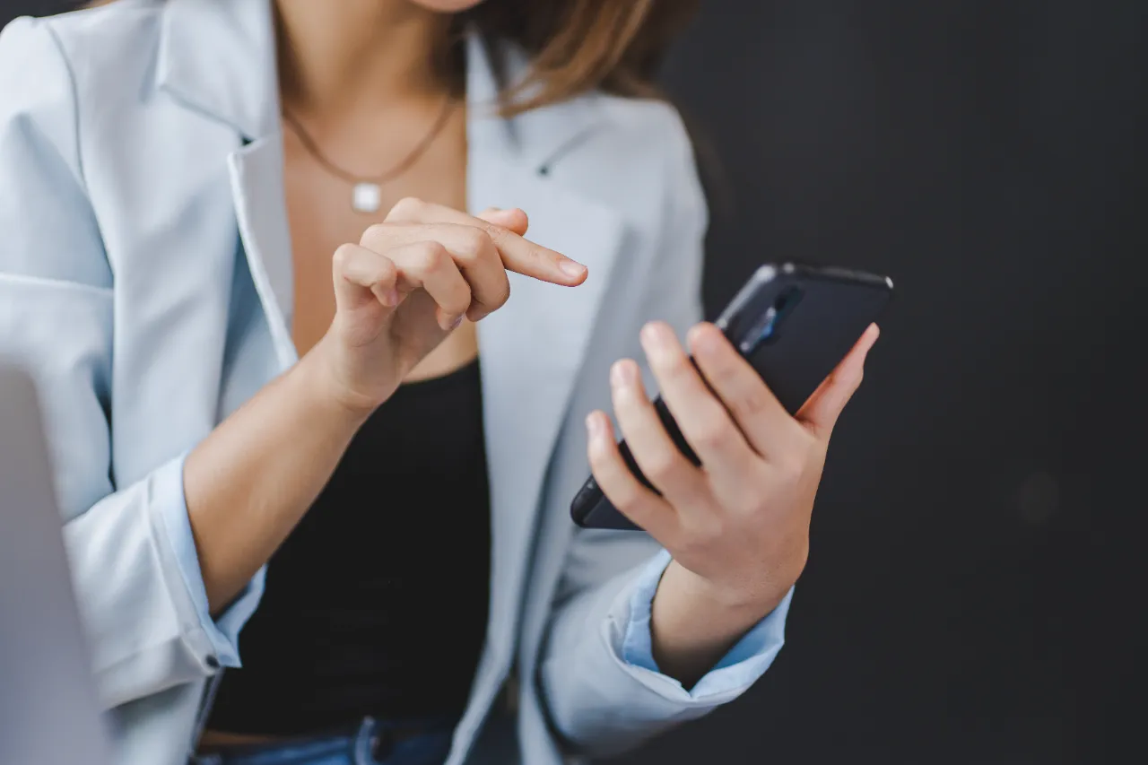 asian businesswoman talking on smartphone and work utc